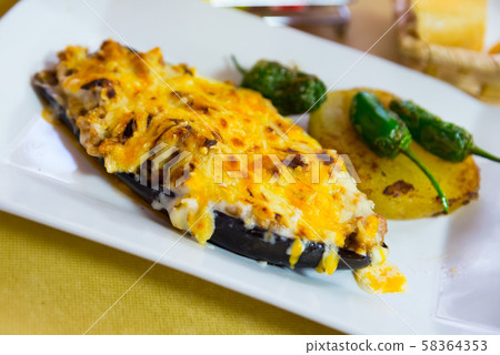 Eggplant stuffed with meat and baked with bechamel sauce and cheese Eggplant stuffed with meat and baked with bechamel sauce and cheese 58364353