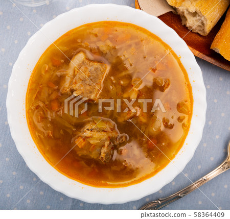 Sour cabbage soup served in bowl Sour cabbage soup served in bowl 58364409