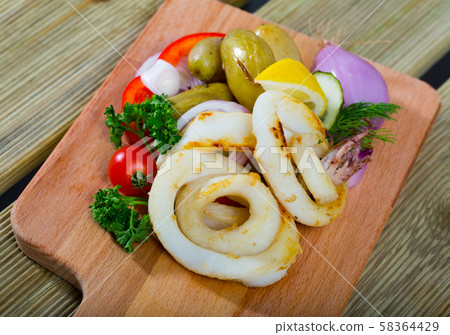 Roasted squid rings 58364429