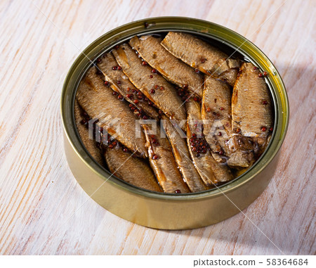 Canned small smoked sardines from Riga in open tin can, nobody Canned small smoked sardines from Riga in open tin can, nobody 58364684