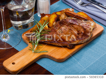 Appetizing entrecote with baked potatoes 58365310
