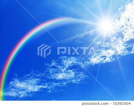 Blue sky and rainbow over the sun Blue sky and rainbow over the sun 58365804