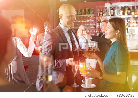 Friendly coworkers on office party Friendly coworkers on office party 58366753