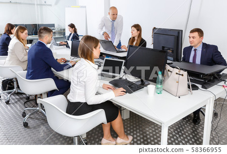 Group of successful business people during daily work in modern co-working space Group of successful business people during daily work in modern co-working space 58366955