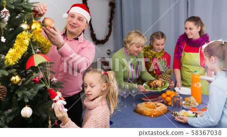 Family is preparing together for celebration New Year 58367038