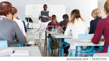 African American student answering at whiteboard 58367230