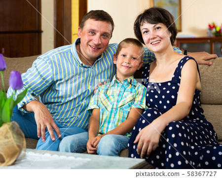 Portrait of smiling family in domestic interior 58367727