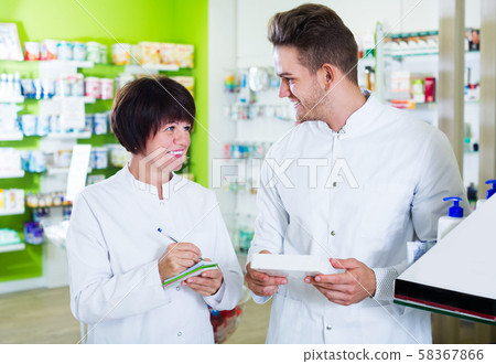 Pharmaceutist working in chemist shop Pharmaceutist working in chemist shop 58367866