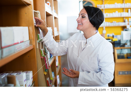 Female pharmacist in store 58368275