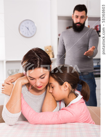Father lecturing wife and daughter 58368603