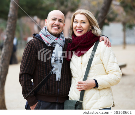 Mature couple on city walk Mature couple on city walk 58368661