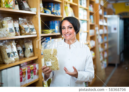 mature woman seller in drugstore . mature woman seller in drugstore . 58368706