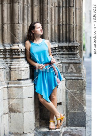 Girl walking in city streets Girl walking in city streets 58369218