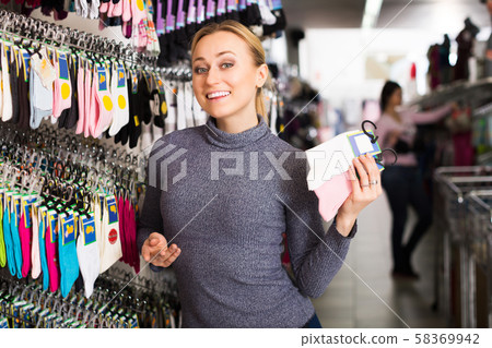 Woman shopping socks in leg-wear 58369942