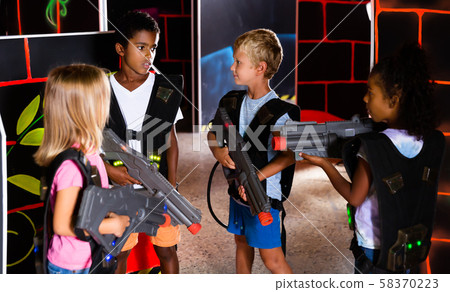 Group of happy tweenagers with laser guns Group of happy tweenagers with laser guns 58370223