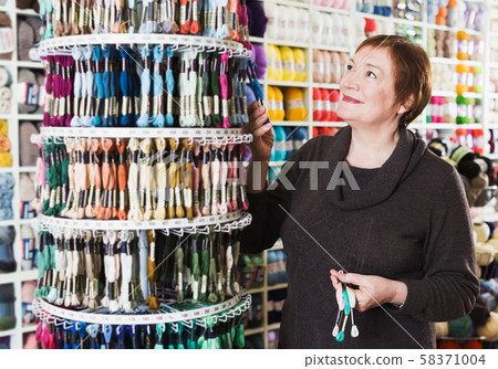 Woman buying mouline Woman buying mouline 58371004