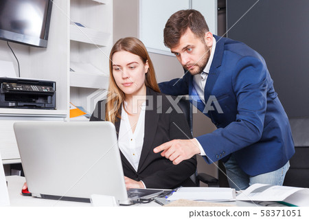 Administrator and seller at workplace in showroom Administrator and seller at workplace in showroom 58371051