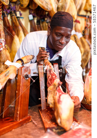 Salesman cutting ham for sale Salesman cutting ham for sale 58371467