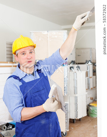 Plasterer working indoors 58372922