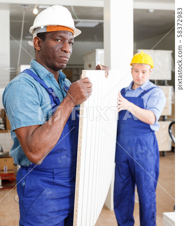 Men contractors working indoors Men contractors working indoors 58372983