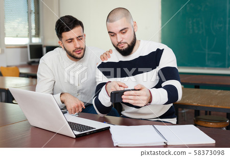University students using mobile phone 58373098