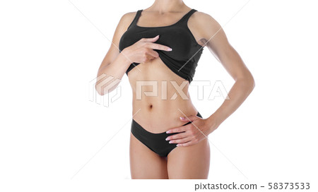 Beautiful slim body of woman in black lingerie isolated on white Beautiful slim body of woman in black lingerie isolated on white 58373533