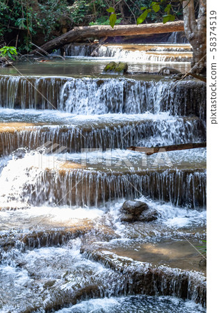 Waterfall flowing from the mountains at Huay Mae khamin waterfall National Park ,Kanchana buri. 58374519