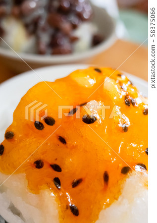 eating passion fruit shaved ice eating passion fruit shaved ice 58375066