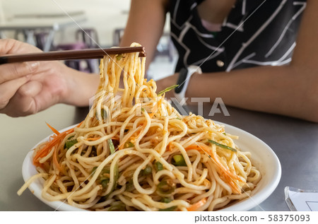 eating cold noodles eating cold noodles 58375093