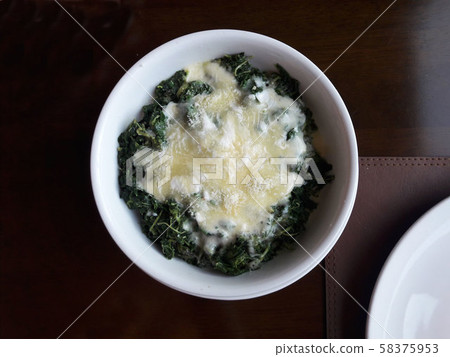 Bake Spinach with cheese in white bowl Bake Spinach with cheese in white bowl 58375953