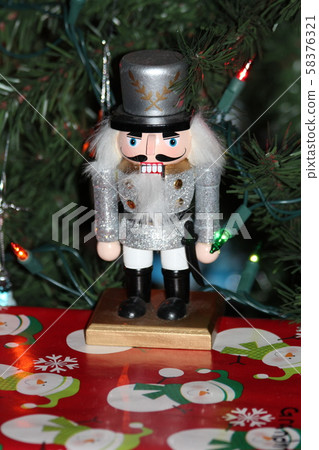 Nut Cracker closeup under a Christmas Tree with red Present's Nut Cracker closeup under a Christmas Tree with red Present's 58376321