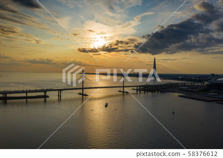 Sunset sky view bridge and skyscraper Sunset sky view bridge and skyscraper 58376612