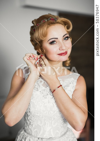Portrait of a beautiful fashion bride, sweet and sensual. Wedding make up and hair Portrait of a beautiful fashion bride, sweet and sensual. Wedding make up and hair 58376947
