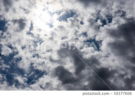 The sun hidden behind a cloud 58377606