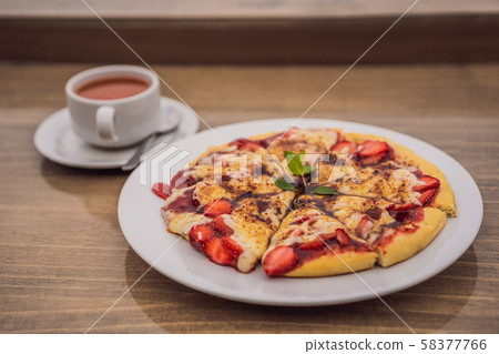 Delicious strawberry pizza on a balinese tropical nature background. Bali island, Indonesia 58377766