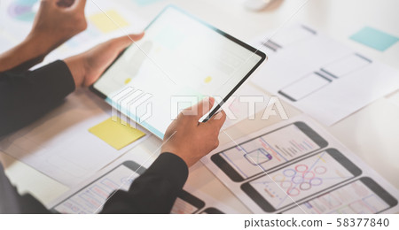 UI designer discussing on interface project UI designer discussing on interface project 58377840