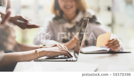 Side view of businesswoman working on her plan Side view of businesswoman working on her plan 58378396