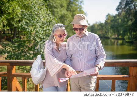 Couple of tourists walking in the national park Couple of tourists walking in the national park 58379977