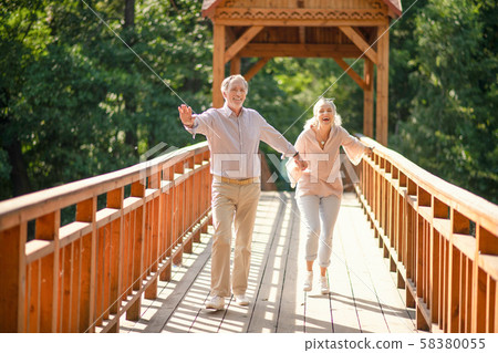 Husband showing his wife amazing place in the park 58380055