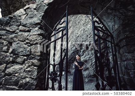 Girls in a black dress with a white collar that 58380402