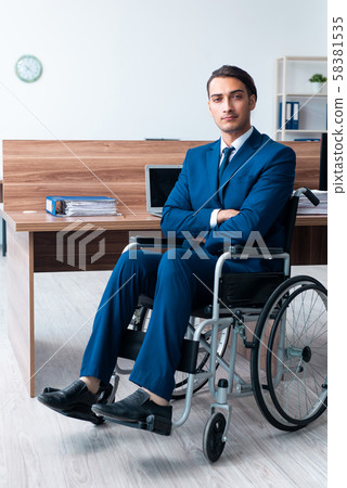 Young male employee in wheel-chair 58381535