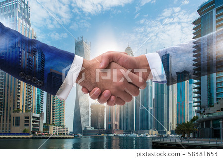Businessman shaking hands in agreement Businessman shaking hands in agreement 58381653