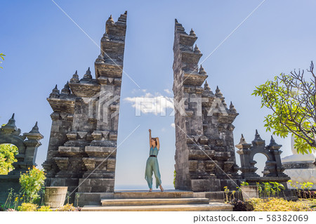 Young woman tourist in budhist temple Brahma Vihara Arama Banjar Bali, Indonesia Young woman tourist in budhist temple Brahma Vihara Arama Banjar Bali, Indonesia 58382069