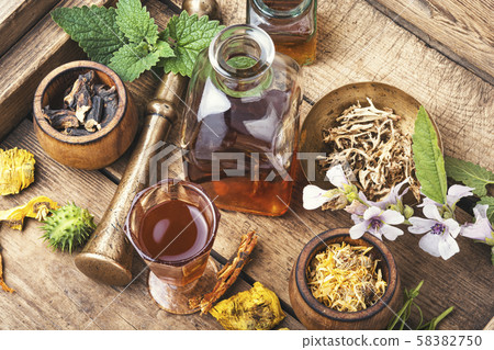 Bottles of tincture and healthy herb Bottles of tincture and healthy herb 58382750