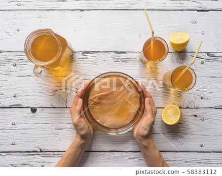 Kombucha fermenting tea with symbiotic culture Kombucha fermenting tea with symbiotic culture 58383112