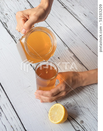 Kombucha fermenting tea with symbiotic culture Kombucha fermenting tea with symbiotic culture 58383209