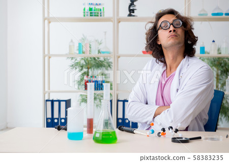 Funny male chemist working in the lab Funny male chemist working in the lab 58383235