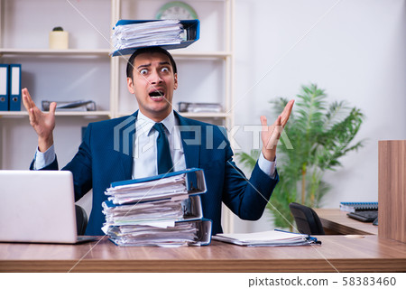 Young handsome businessman working in the office 58383460