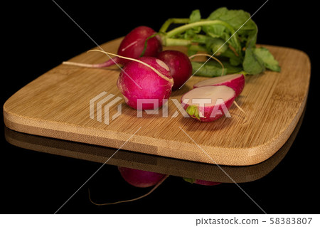 Fresh red radish isolated on black glass 58383807
