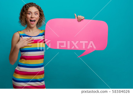 Model holding paper speech bubble with copy space for text. Model holding paper speech bubble with copy space for text. 58384026